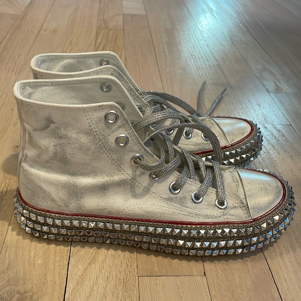 Nan-Ku studded and distressed sneakers.